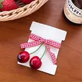 Cute red cherry hair accessory with a red plaid bow on a cream cardboard display - 2# Red & White Gingham Bow Cherry Clip