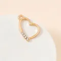 Macro detail of a heart-shaped gold plated alloy pendant with small diamond accents - Dot Rhinestone Heart (19#)
