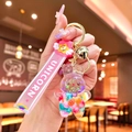 Cute bunny liquid quicksand keychain with pink wristband and colorful glitters - Glow-in-the-dark Rainbow Candy Beans [white Rabbit]