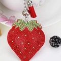 Sparkling strawberry keychain with red rhinestones and a stylish hanging tassel - Red with Light Green Leaf