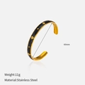 Detail of a 18K gold plated stainless steel star bangle with 60mm diameter and 11g weight - Black