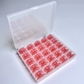 25 Red Bobbins In A 25-compartment Box / Shuttle Core Storage Box