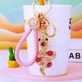 Detail of snake keychain with sparkling rhinestones and pink woven leather strap - Pink Lucky Rope + Rose Pink Snake