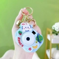 Blue camera-shaped whack-a-mole game keychain with golden bell and space motifs - Little Rabbit Projector Camera - Blue