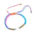 Detail of colorful woven bracelet with golden metal beads and adjustable drawstring - Bracelet: 40
