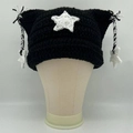 Black cat ear knit beanie featuring white star patterns and tassel star pendants - Black White Star