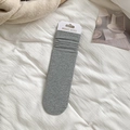Grey slouchy cotton crew socks for women featuring ribbed cuffs and white paper card packaging - Light Gray