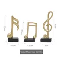 Three-piece golden musical note ornaments with black bases for desk decoration - Gold