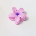 Macro detail of 8cm plumeria claw clip showing pink gradient resin petals and teeth - Glossy Pink Purple Gradient