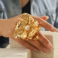 Exaggerated gold flower ring with large pearl center and irregular metallic petals - Large Flower Pearl Ring