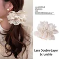 Elegant large ivory lace floral hair scrunchie shown on a ponytail and flat lay - Lusi Style Double Lace Scrunchie / Beige