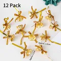 Set of 12 gold Christmas bells with glitter finish and decorative bows for DIY crafts - Small Bells 12 Pcs