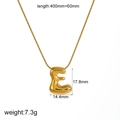 Macro detail of golden letter E pendant showing dimensions 17.8mm by 14.4mm on white background - Letter E