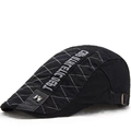 Detail of vintage black beret hat with white diamond stitching and athletic embroidery - M Label Patchwork Style / Black