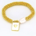 Close-up of golden beaded bracelet with white baroque pearl and heart pendant - Heart Relief Style (08#)