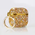 Close-up of gold sparkling rhinestone AirPods case with metallic ring attachment - AirPods 3rd Gen / Gold