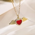 Elegant gold necklace with a red heart pendant and wings on white silk background - Micro-pave Winged Heart / Gold
