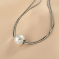 Elegant silver snake chain necklace featuring a large white round pearl pendant - Large Bead / Steel
