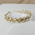 Close-up of golden headband with champagne marquise rhinestones in leaf patterns - Navette Champagne Style