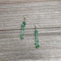 Detail of handmade drop earrings featuring green natural crystal stones and silver beads - Silver - Prehnite