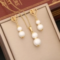 Golden heart necklace and earrings set with double pearls and cross charms - White