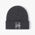 Dark grey knitted beanie featuring white IT IS WHAT IT IS embroidery for autumn winter - One Size / Dark Heather Grey