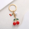 Red cherry and pearl charm keychain with golden finish for bags and backpacks - Solid Red Cherry (Gold Metal)
