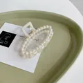 Elegant cream faux pearl hair claw clip with rhinestones in a minimalist design - Oval Pearl