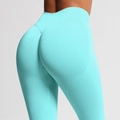 Detail der nahtlosen High-Waist-Yogahose in Blau mit Po-Lifting-Konturierungseffekt - XS / Minzgrün
