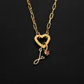 Gold-plated stainless steel heart clasp necklace with initial J and pink gemstone pendant - Letter J