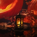 Macro shot of a black vintage Halloween lantern with witch and bat silhouette and LED candle - Broom Witch Lantern