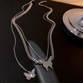 Collana doppia in argento con ciondoli a farfalla su catena cubana e fine - Ciondolo Farfalla a Strati Argento