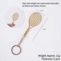 Mini golden alloy tennis racket keychain pendant with detailed mesh texture - Keychain style / Gold Tennis Racket