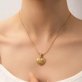 Close-up of gold heart pendant necklace with matte brushed texture on a female model - Frosted Brushed Heart Style (N0202)