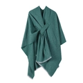 Detail of turquoise knitted poncho wrap showing soft fabric texture and fringe trim - Green