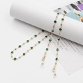 Golden eyewear chain with emerald and clear crystals featuring white silicone loops - Green Rhinestone Beaded