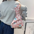 Detail of linen wrist bag with polar bear print and asymmetric knotted handle closure - Pink Polar Bear