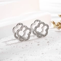 Detail of silver titanium steel flower earrings with sparkling cubic zirconia pavé - Ear Buckle / Steel White Flower
