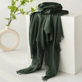 Elegant dark green cotton linen scarf with frayed edges displayed on a white stand - Dark Green