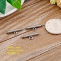 Three 3mm silver magnetic stainless steel clasps shown with a reference coin - Style 1 - Magnetic - Steel