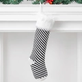 Knitted Christmas stocking with black and white stripes and fluffy white plush trim decor - Black and White Pinstripe