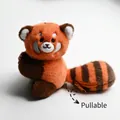 Detail of red panda plush keychain featuring a unique retractable tail with orange zipper - Panda Guoguo Side Pose Style