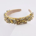 Detailed macro of yellow velvet headband with colorful luxury rhinestone embellishments - G Yellow