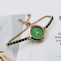 Elegant gold quartz watch with emerald green dial and crystal bracelet for women - Green