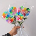 Handmade rainbow sunflower bouquet made of pipe cleaners in transparent wrap - Finished Rainbow Sunflower