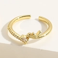 Macro shot of gold geometric adjustable ring with detailed zircon stone settings - Adjustable Open / Water Drop White Zirconia