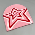 Detail of pink knitted beanie featuring a red and white layered star pattern embroidery - One Size / Pink