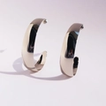 Polished silver wide C-shape hoop earrings with a modern metallic mirror finish - White Gold