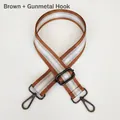 Detail view of adjustable nylon bag strap with silver stripes and gunmetal metal hooks - Brown + Gunmetal Hook