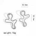 Detailed view of silver irregular geometric earrings with dimensions 43.5mm and 55.1mm - Silver Wave Irregular Earrings (TE60180-S)